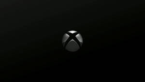 在深色漸變背景上閃亮的 Xbox 標誌