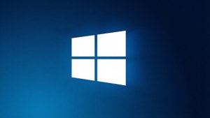 Windows標誌在藍色漸變背景上發光。 — 視窗 壁紙