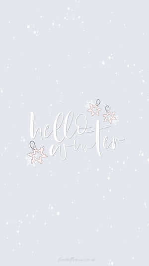 灰色背景上雪花飄落的 hello winter 文字