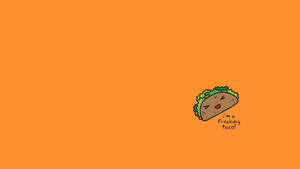 一個微笑的卡通玉米餅，橙色背景上寫著 i'm a freaking taco。