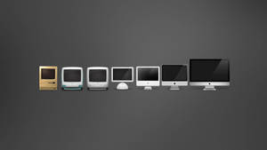 七代 Apple 電腦在灰色背景上排列。 — 簡約桌面壁紙