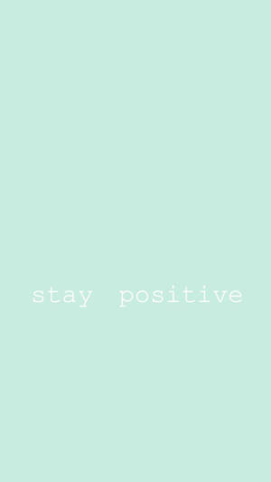 薄荷綠色背景，白色文字寫著 stay positive — 薄荷綠 壁紙