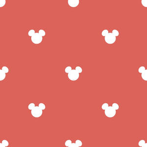 珊瑚粉紅色牆紙，帶有重複的白色米奇老鼠頭部剪影。