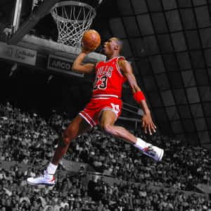米高佐敦身穿紅色公牛球衣空中入樽。 — Jordan 標誌 GIF 壁紙