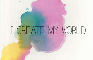 粗體文字「I CREATE MY WORLD」覆蓋在紋理畫布上的彩色水彩潑濺之上。 — MacBook Air 13 壁紙