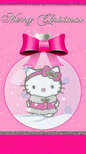 Hello Kitty 穿著粉紅色冬季外套，在一個帶有雪花的水晶球內。
