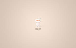 白色外星人吉祥物，橙色眼睛和天線，居中在米色背景上，帶有reddit文字。