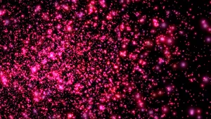 粉紅色閃粉粒子漂浮在黑暗虛空中