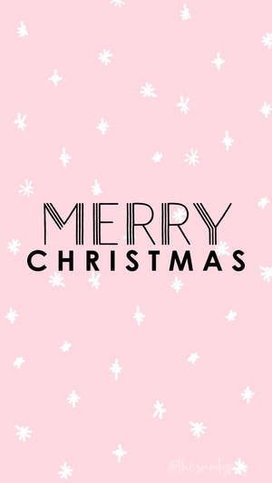 粉紅色牆紙，帶有白色雪花和黑色Merry Christmas文字。 — 聖誕節 iPhone 壁紙