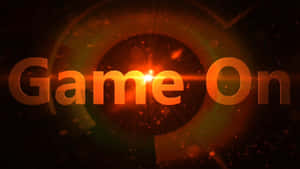 發光的橙色 'Game On' 文字，帶有宇宙粒子和鏡頭光暈。 — YouTube 壁紙