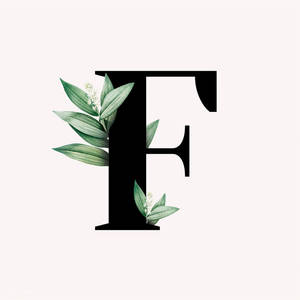 以綠色葉子和白色花朵裝飾的黑色字母F。