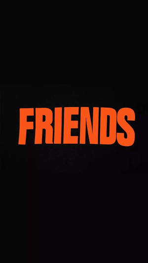 橙色 'FRIENDS' 文字在黑色背景上。 — 肖像 壁紙
