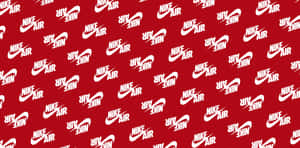 帶有散佈白色Nike Air標誌的紅色背景 — 型格 Nike 壁紙