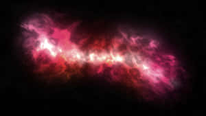 在深空中發光的鮮豔紅色和粉紅色宇宙星雲。