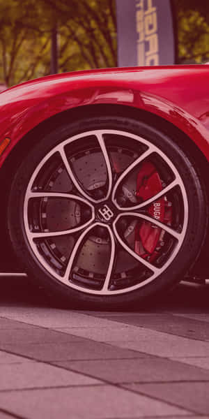 紅色Bugatti跑車車輪，帶有白色輻條和紅色制動卡鉗，在路面上。 — 布加迪 壁紙