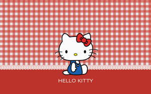 Hello Kitty 卡通角色穿著藍色連衣裙，背景為紅白格子。