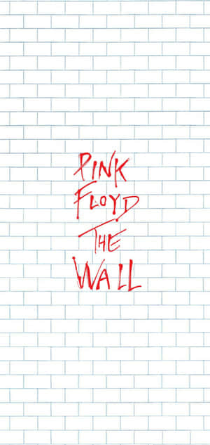 白色磚牆上以紅色寫成的Pink Floyd The Wall。
