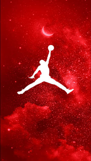 白色籃球運動員剪影，持球跳躍，背景是紅色星空和新月。 — Air Jordan GIF 壁紙