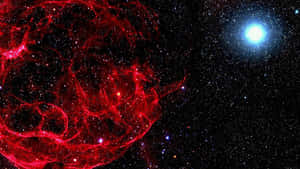 深空中無數星星之間的紅色星雲和藍色星星。 — 紅色美學 壁紙