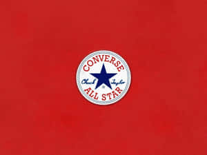 紅色布料背景上的 Converse All Star 標誌貼片 — 紅色 壁紙