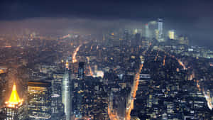 紐約市夜景鳥瞰圖，建築物和街道燈火通明。 — 美麗的日落動畫 壁紙