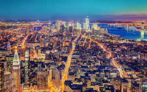紐約市黃昏時分天際線，燈火通明的建築物和橋樑。 — 夜空 壁紙
