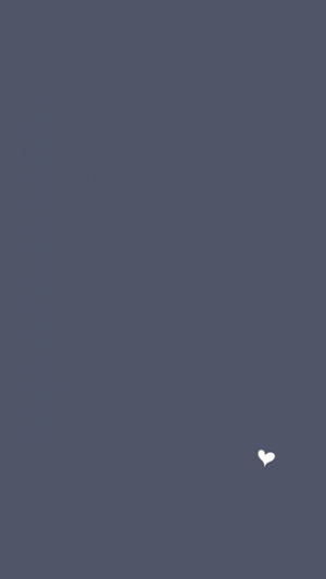 在純藍色背景上的一個白色心形圖標。 — 灰色 GIF 壁紙