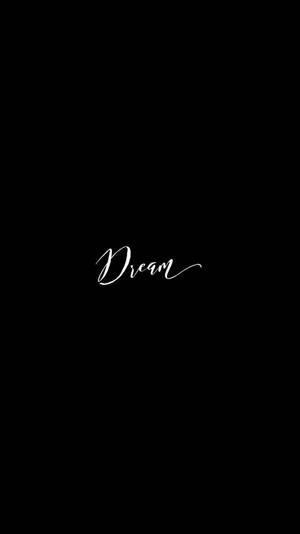 黑色背景上的白色草書Dream