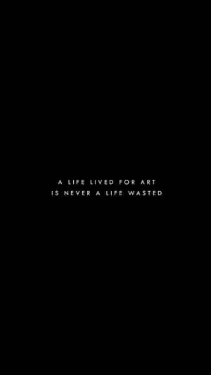 黑色背景，白色居中文字寫著「A LIFE LIVED FOR ART IS NEVER A LIFE WASTED」 — 黑色電話 壁紙