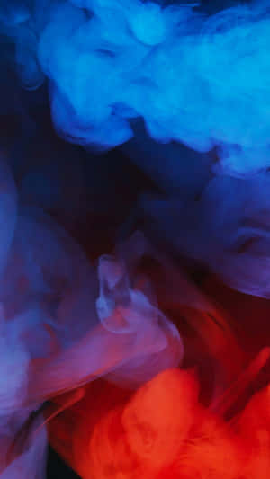 深色背景上藍色和紅色煙霧的抽象漩渦。 — 紅色和藍色 GIF 壁紙
