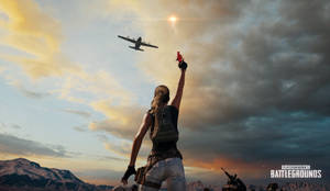 PUBG 玩家在飛機下降至山區日落景觀上空時舉起信號槍。
