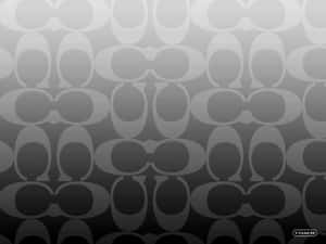 灰色漸變牆紙，帶有重複的Coach標誌圖案。