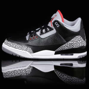 黑、白、紅色的 Air Jordan 3 運動鞋，象紋鞋底，反射表面。