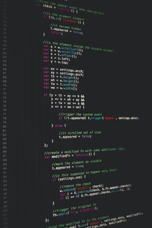 電腦螢幕特寫，顯示帶有語法高亮的 JavaScript 代碼。