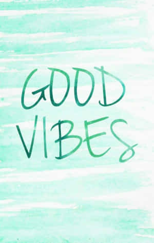 在薄荷水彩背景上以綠色手寫的Good vibes