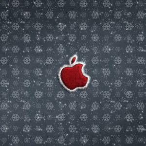 紅色編織Apple標誌，帶白色流蘇，在雪灰色背景上。