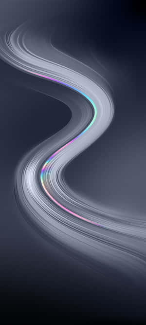 一條發光的彩虹絲帶在深色背景上優雅地彎曲流動。 — Honor Play 80 Pro 壁紙