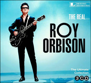 Roy Orbison 身穿黑色西裝和太陽眼鏡，在藍色專輯封面上手持結他。