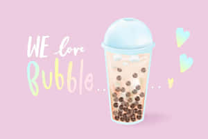 粉紅色背景上嘅珍珠奶茶杯，有啡色珍珠同心形，仲有文字WE love Bubble。