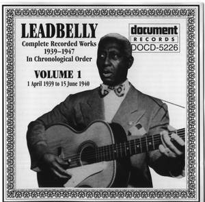 Leadbelly 在帶有華麗邊框的復古專輯封面上彈奏結他。