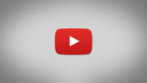 灰色漸變背景上的 YouTube 播放按鈕標誌