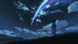一個女孩在繁星點點的夜空中觀看一顆色彩繽紛的流星。