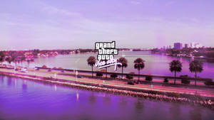 Grand Theft Auto Vice City 標誌位於有棕櫚樹和水的海岸城市上方。