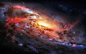 一個色彩繽紛的螺旋星系，在太空中旋轉著紅色、藍色和金色色調。