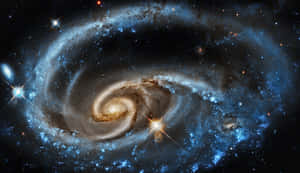 深空中帶有藍色星場和發光塵埃帶的螺旋星系。 — 行星 壁紙