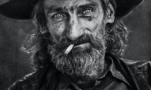 特寫一個戴帽子的鬍鬚男拿著香煙。