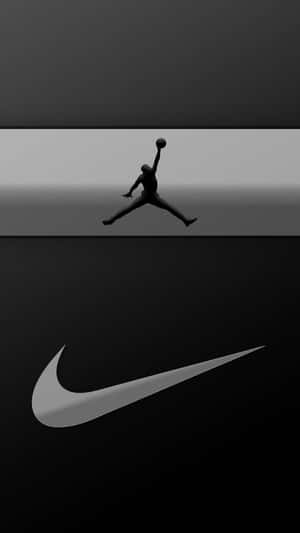一名籃球運動員在Nike剔號標誌上方入樽的剪影。