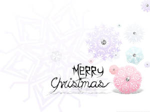 帶有裝飾性紙雪花和寶石點綴的「Merry Christmas」問候。