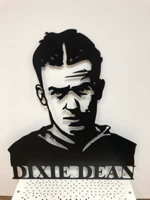 一個黑色金屬剪影肖像，下方有名字 Dixie Dean。 — 占士甸 GIF 壁紙