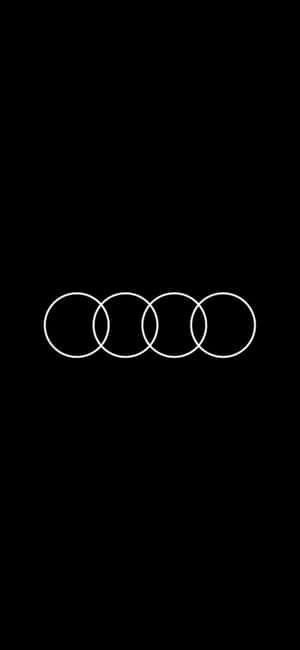 黑色背景上的四個相互交織的白色圓環 Audi 標誌